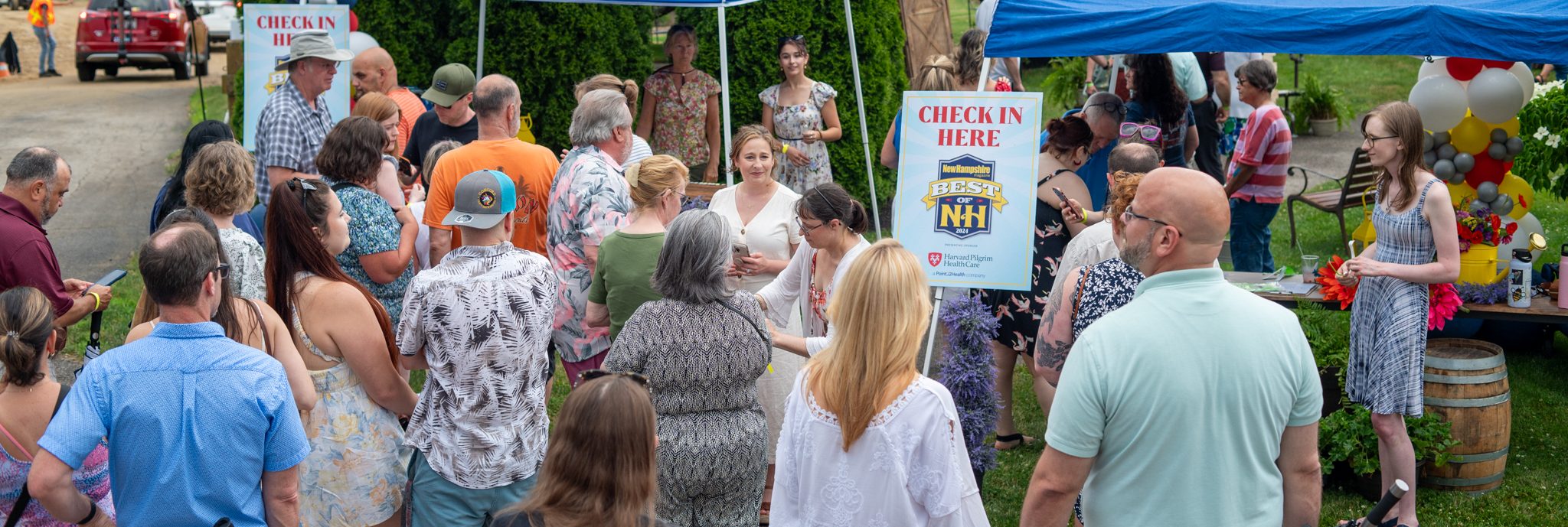 Yankee Publishing staff check in a crowd of guests at the 2024 Best of New Hampshire Party.